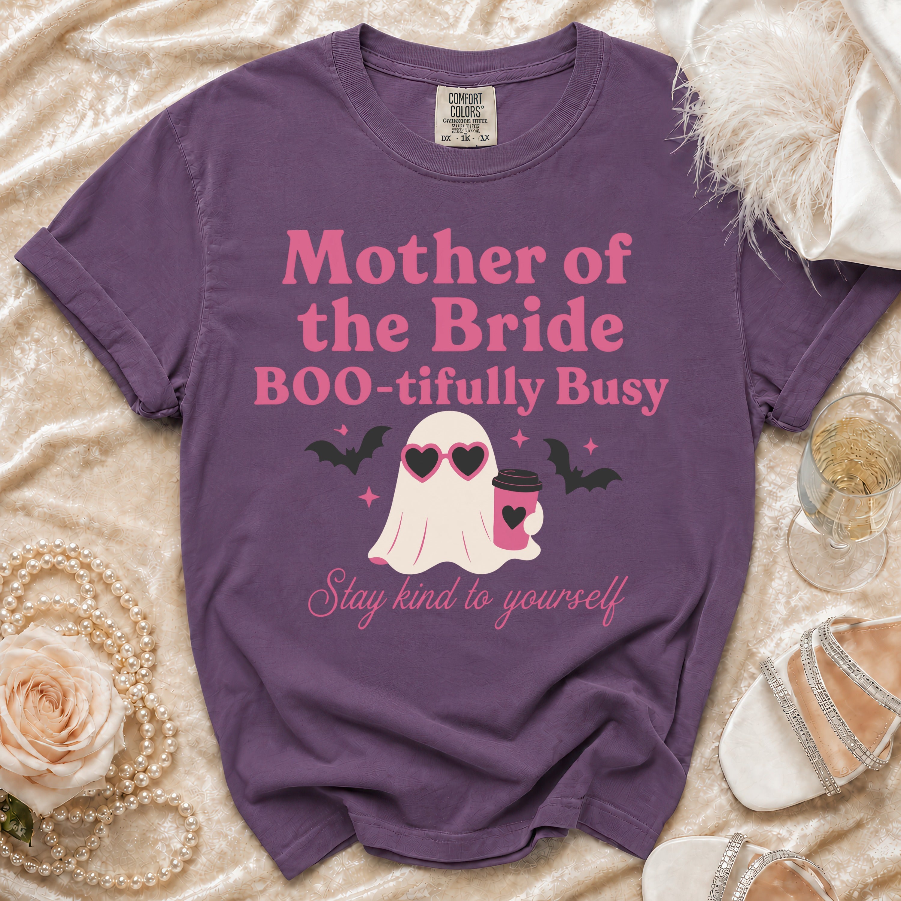 Purple t-shirt with text "Mother of the Bride BOO-tifully Busy" and a ghost graphic.