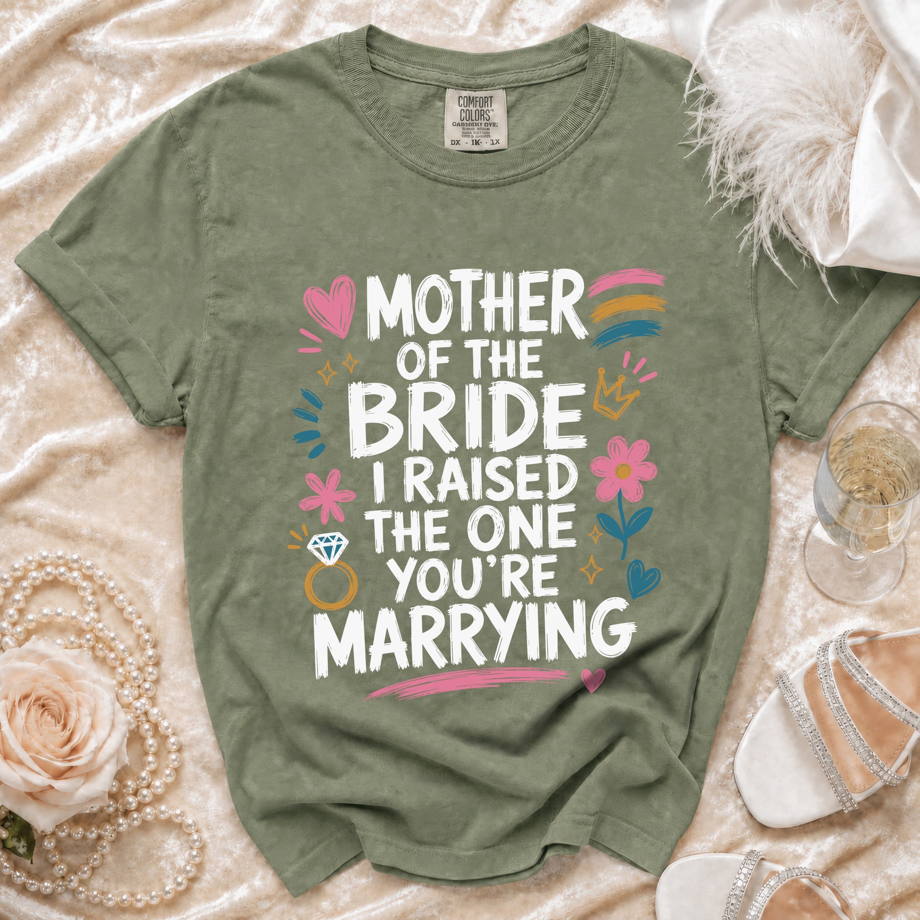 Green t-shirt with white text: Mother of the Bride, I Raised the One You're Marrying.