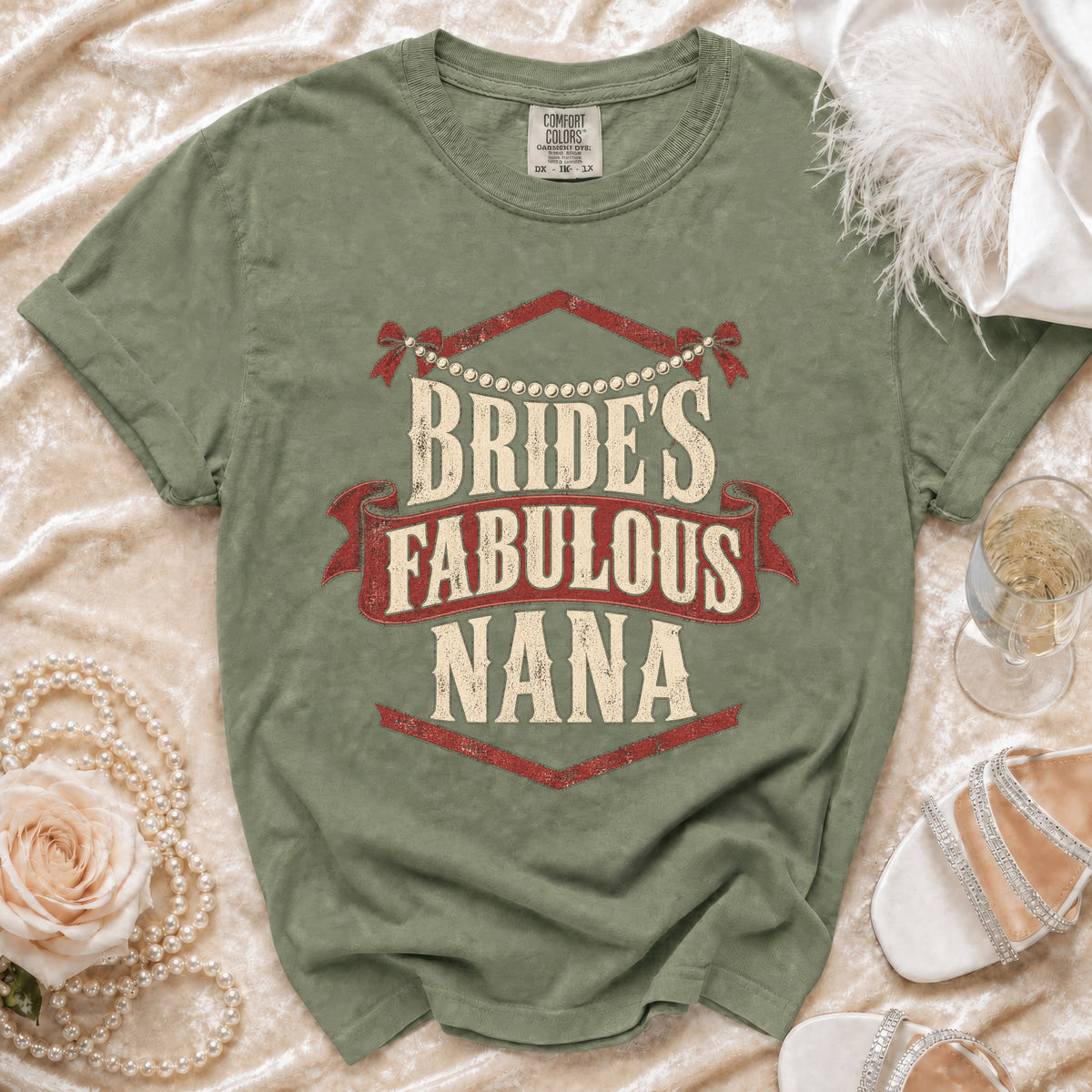 Olive green t-shirt with "BRIDE'S FABULOUS NANA" text in distressed print.