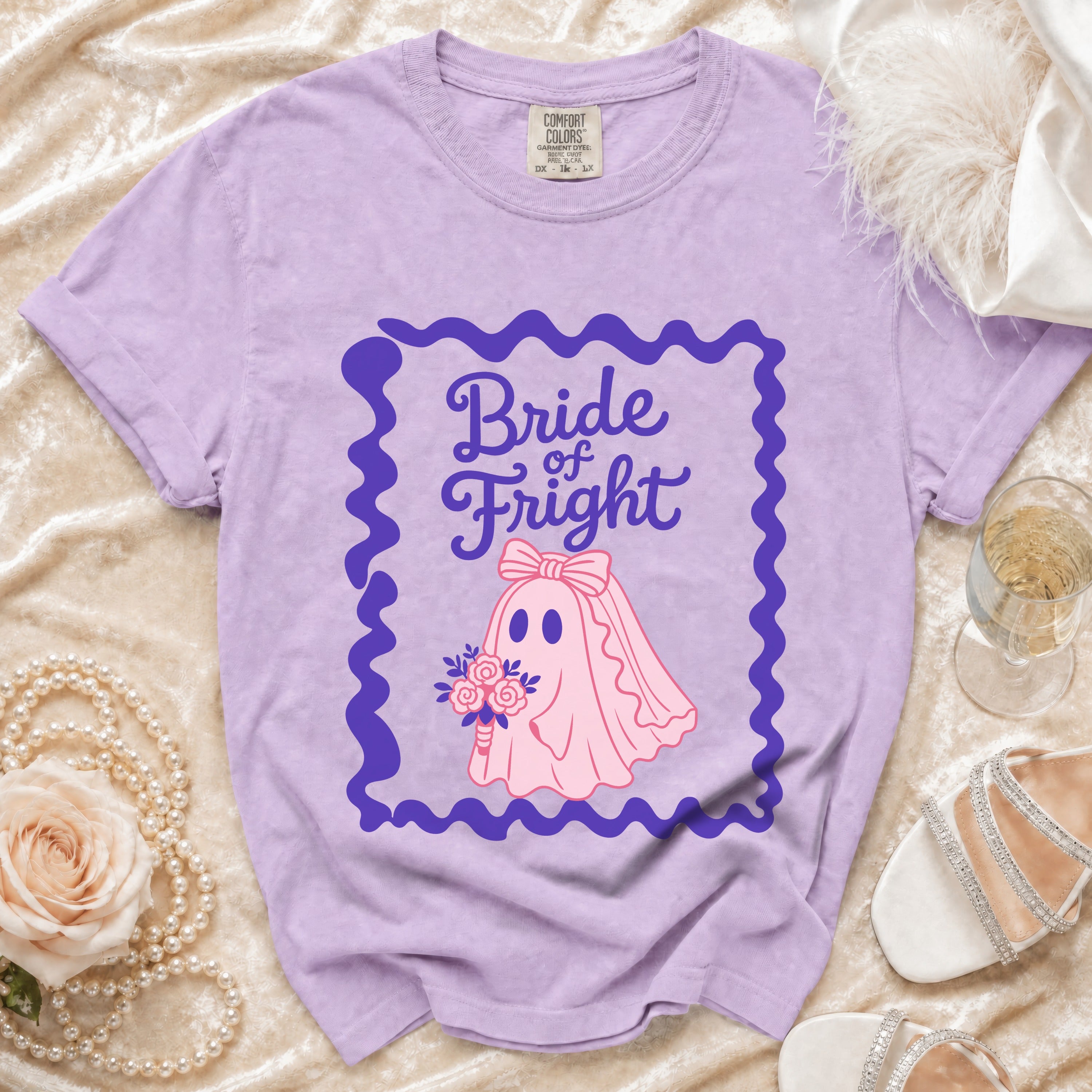 Bride of Fright graphic on a lavender t-shirt with a ghost wearing a veil and holding flowers.