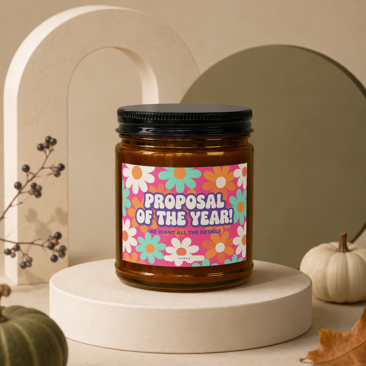 Amber jar candle with "Proposal of the Year!" text on floral label.