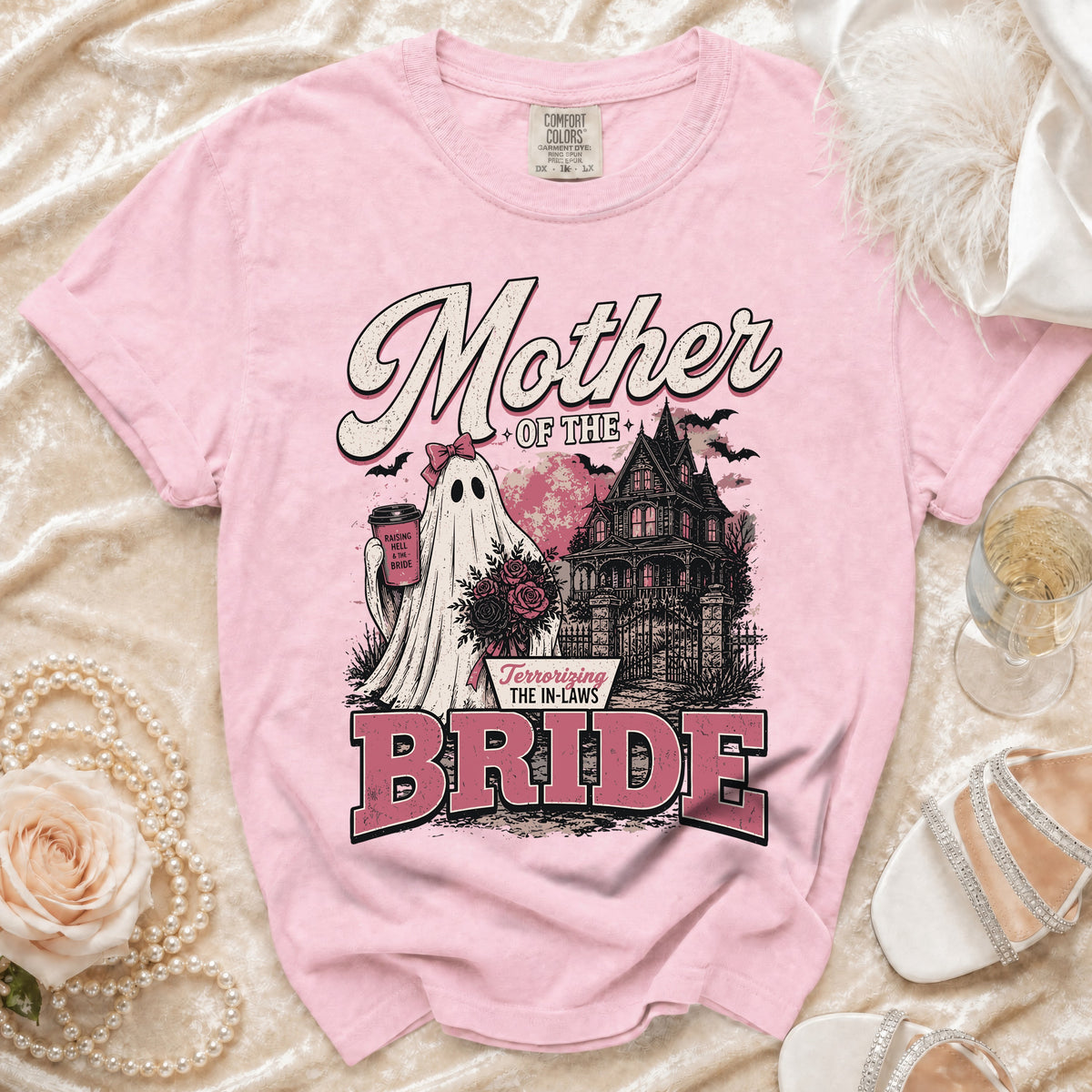 Pink shirt with "Mother of the Bride" text and ghost bride graphic.