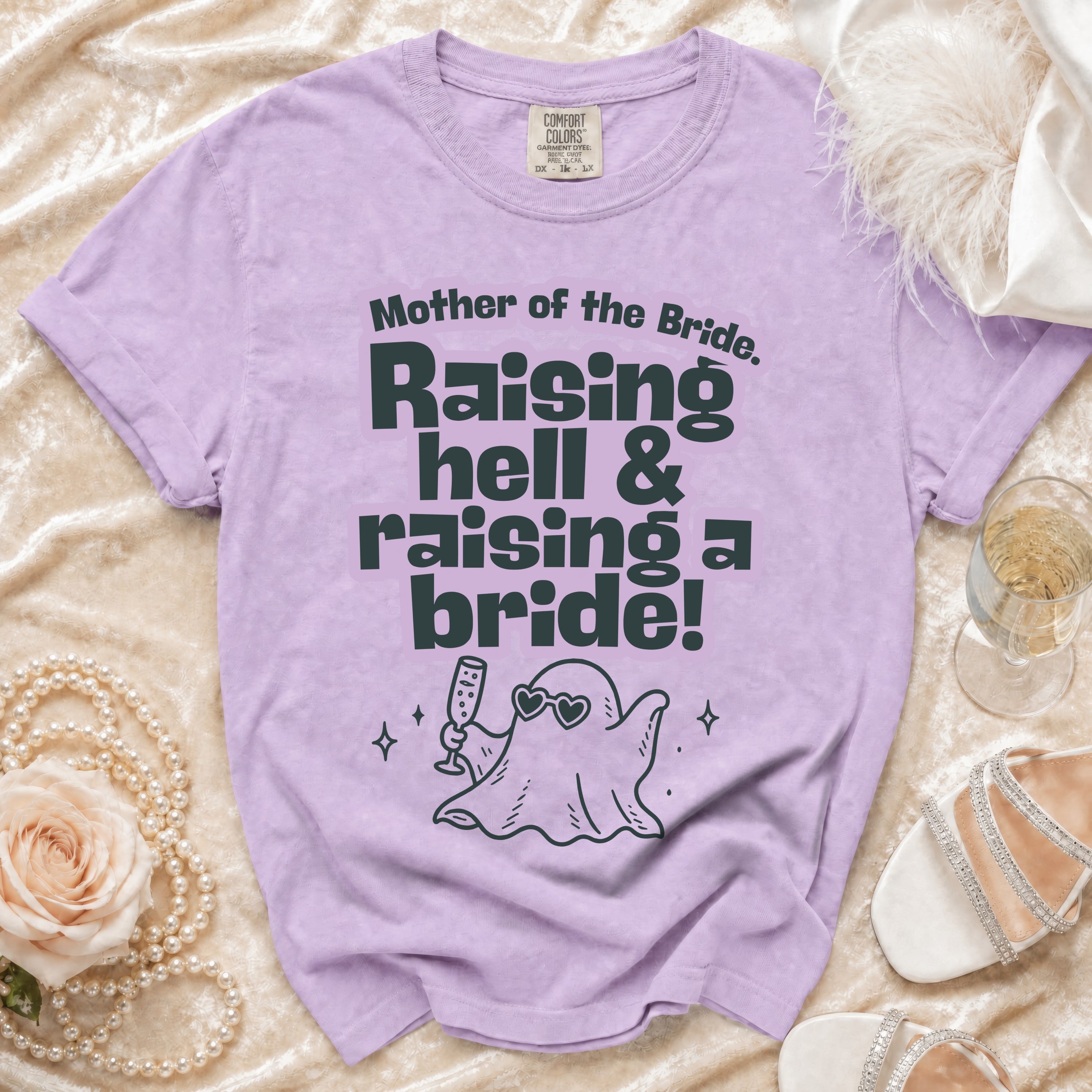 Purple t-shirt with "Mother of the Bride. Raising hell & raising a bride!" text and ghost graphic.