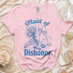 Pink t-shirt with blue text and graphics: "Maid of Dishonor," a bouquet, champagne, lipstick, and crown.