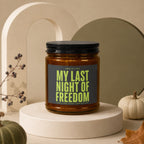 Amber jar candle with black lid labeled "My Last Night of Freedom."