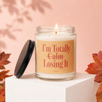 Candle with text "I'm Totally Calm Losing It" on a peach background.