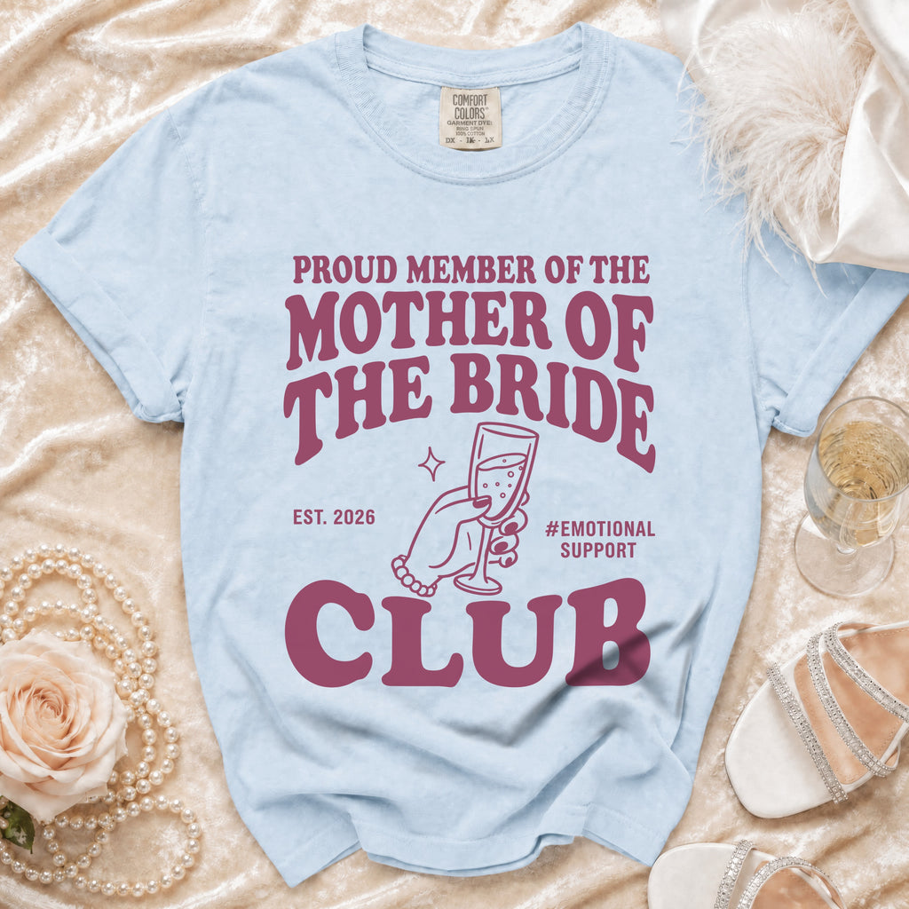 Light blue t-shirt with "Proud Member of the Mother of the Bride Club Est. 2026" text.