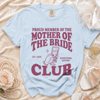 Light blue t-shirt with "Proud Member of the Mother of the Bride Club Est. 2026" text.