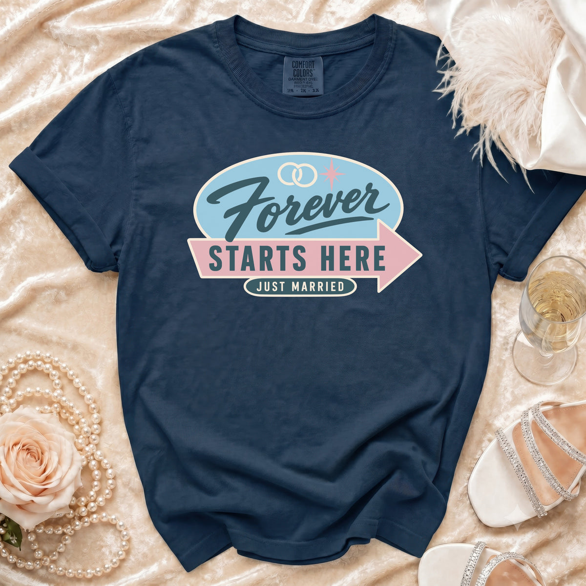 Navy t-shirt with "Forever Starts Here Just Married" text and wedding rings.