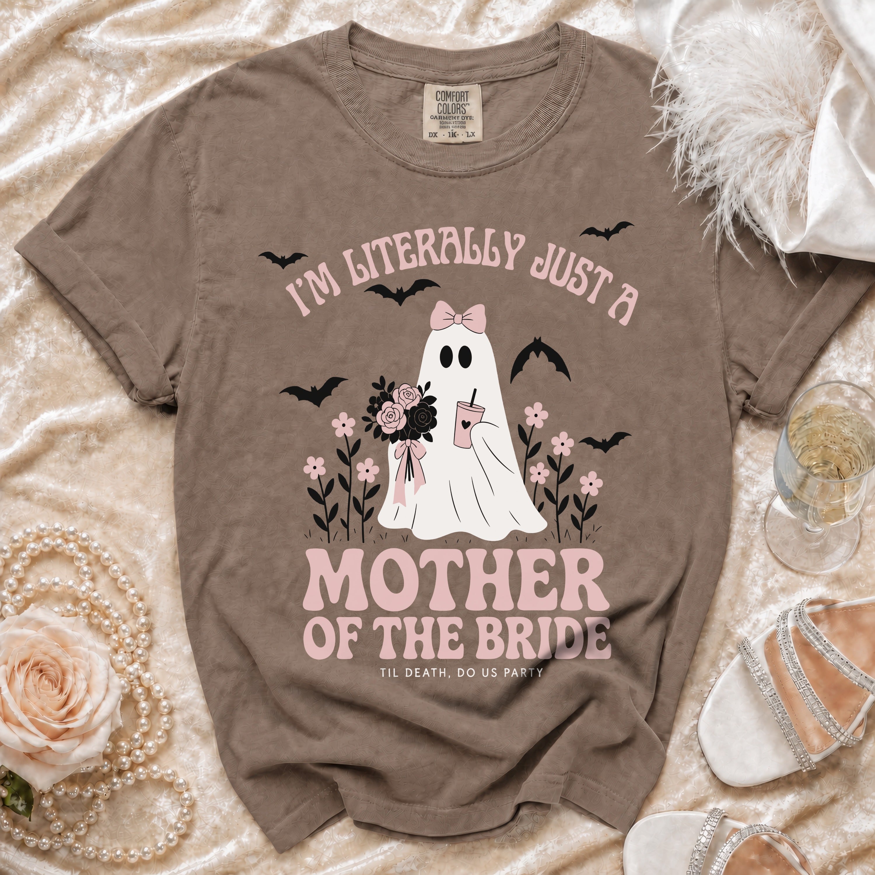 Brown t-shirt with a ghost holding flowers, bats, and text "I'm Literally Just a Mother of the Bride".