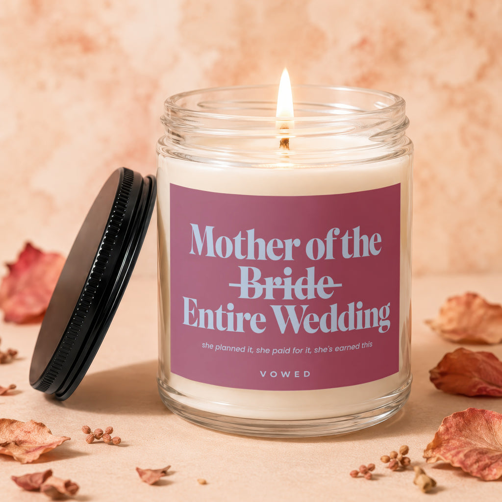 Lit candle with label "Mother of the Bride Entire Wedding Vowed".