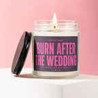Jar candle with "Burn After The Wedding" label and lit wick.