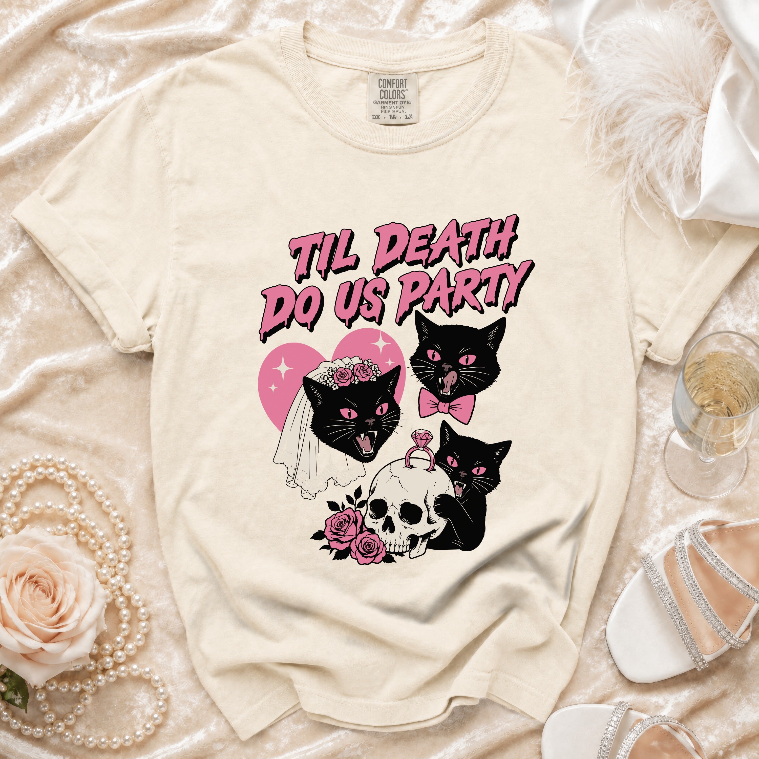 Cream t-shirt with "Til Death Do Us Party" text and black cats, skull, roses.