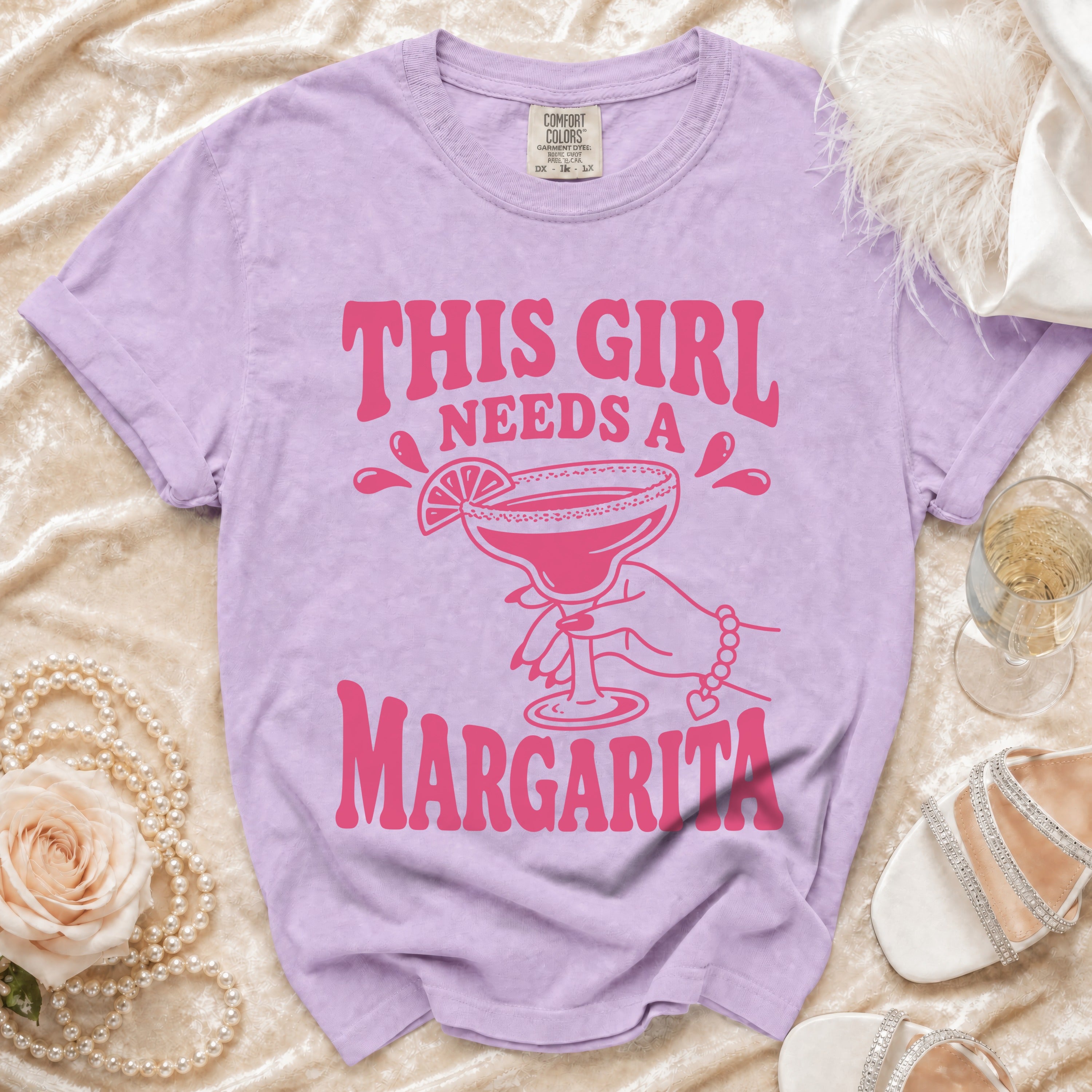 Lavender t-shirt with "THIS GIRL NEEDS A MARGARITA" graphic.