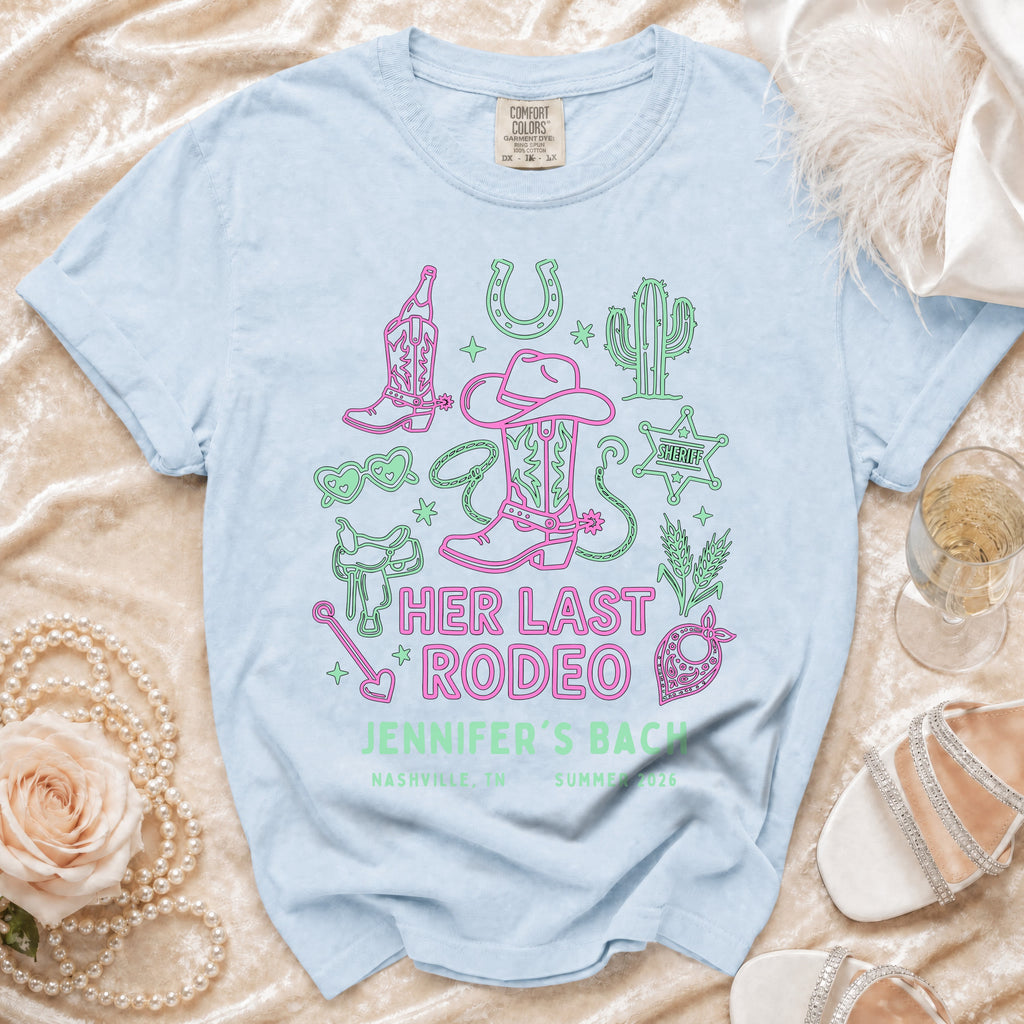 Light blue t-shirt with "HER LAST RODEO JENNIFER'S BACH" and western graphics.
