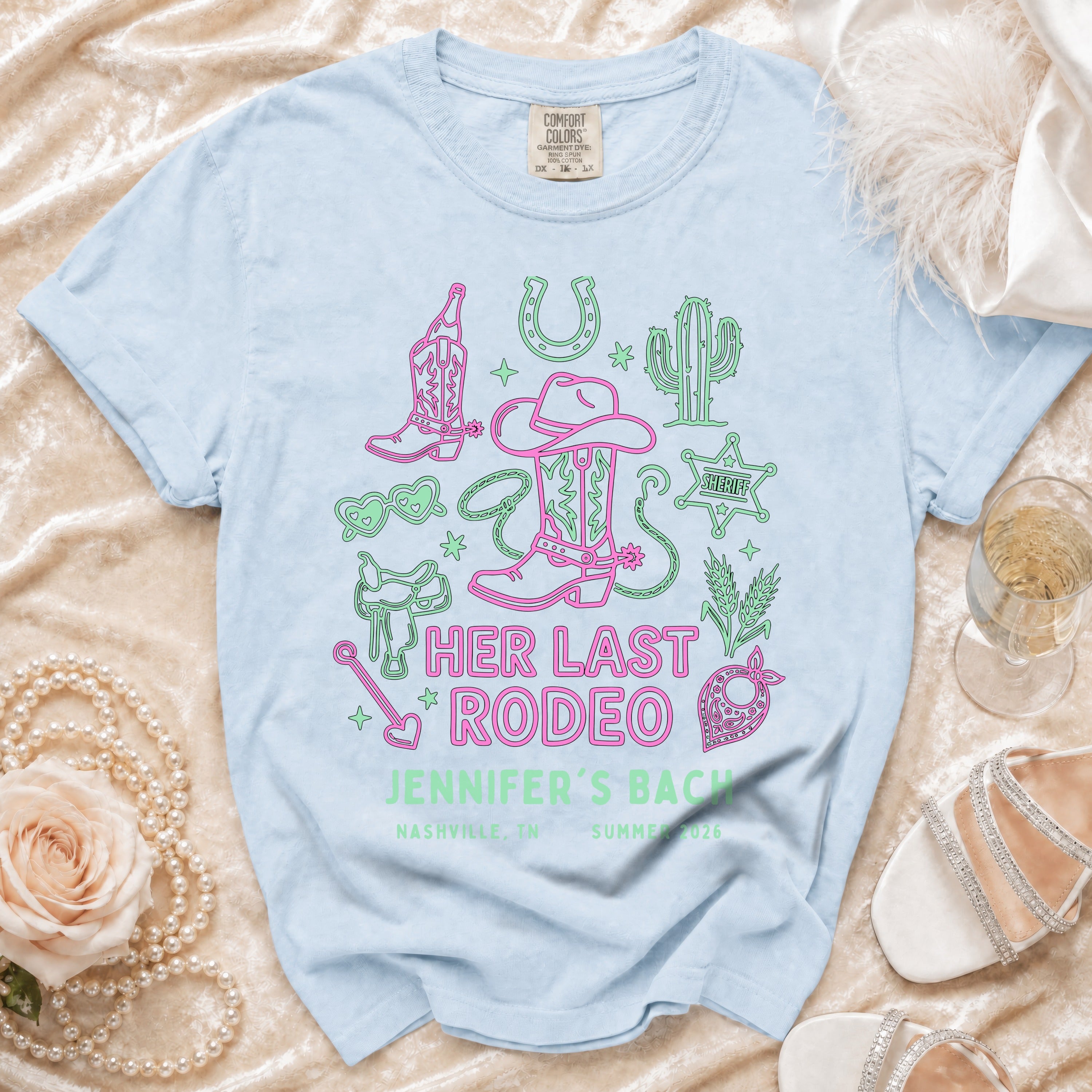 Light blue t-shirt with "HER LAST RODEO JENNIFER'S BACH" and western graphics.