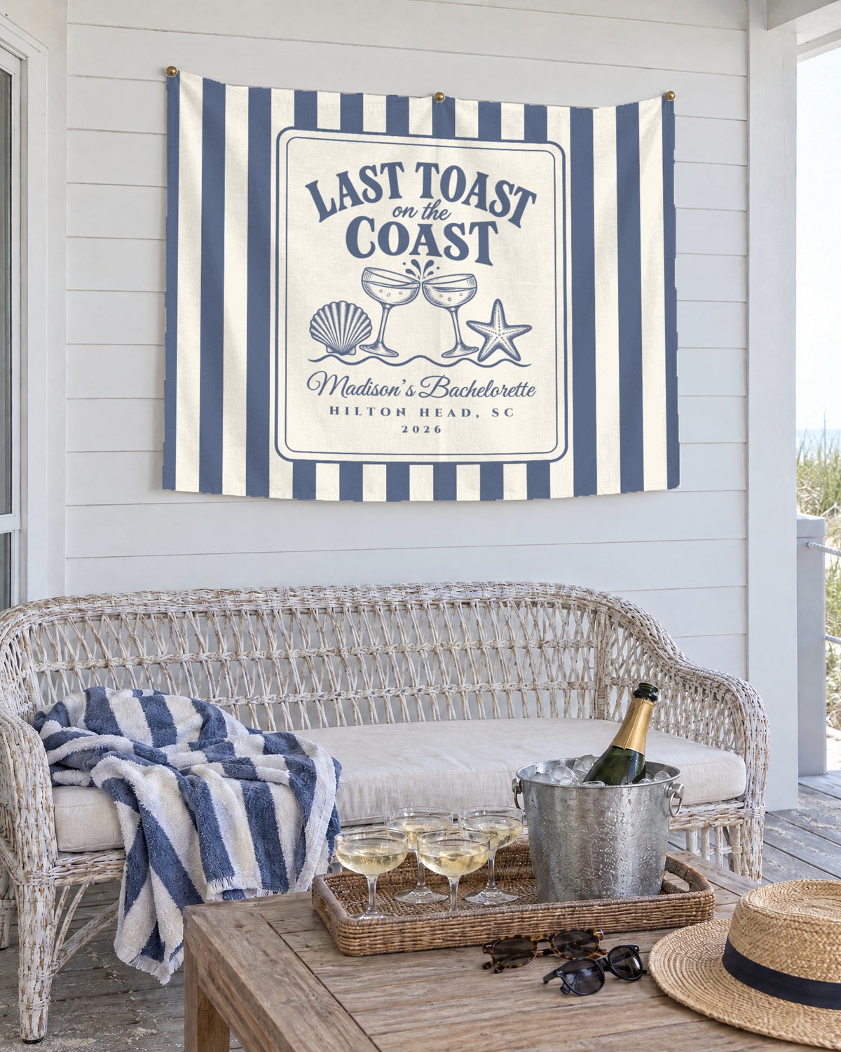 Last Toast On The Coast personalized wall tapestry in Blue Jean on a beach house porch wall