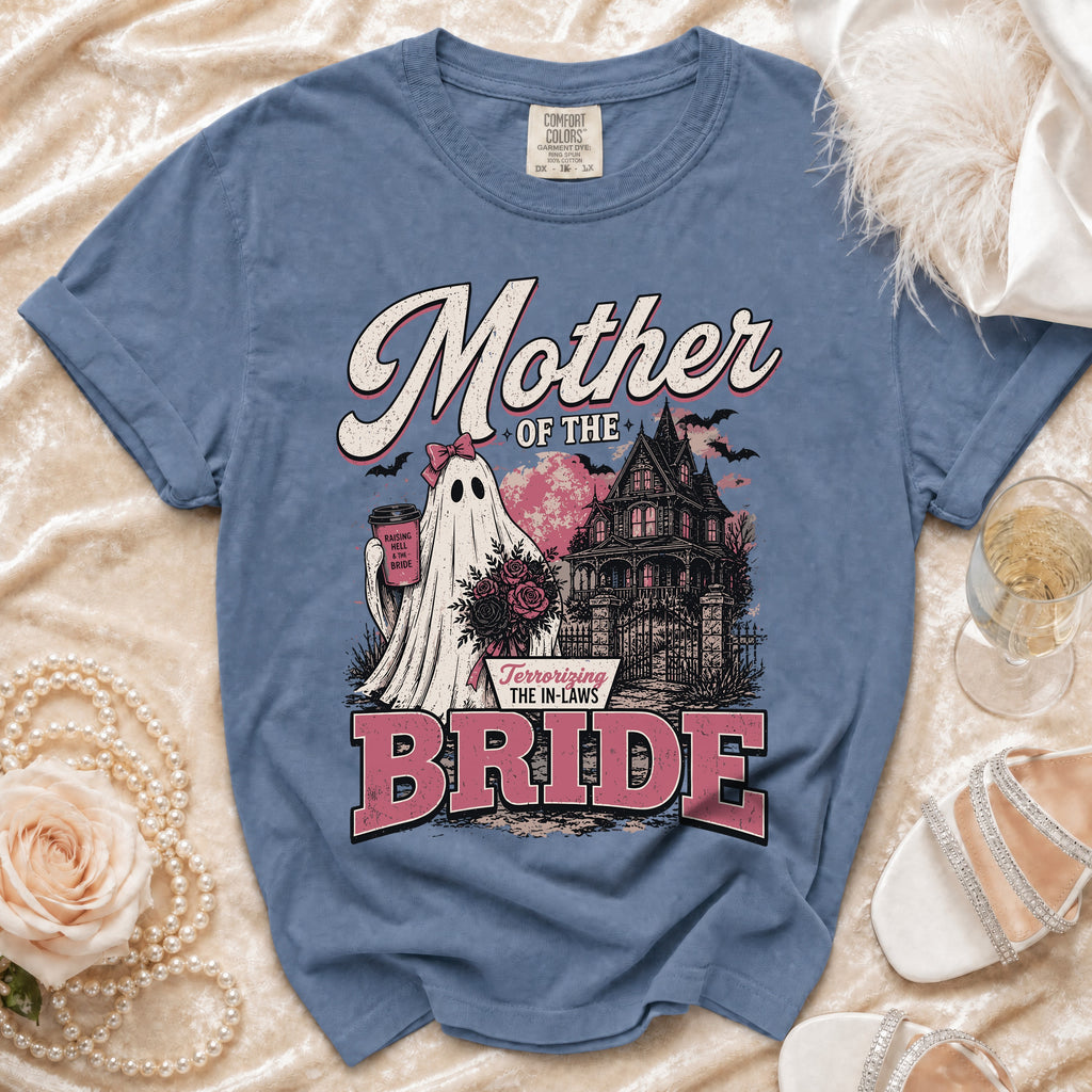 Blue t-shirt with "Mother of the Bride" text, a ghost, and haunted house graphic.