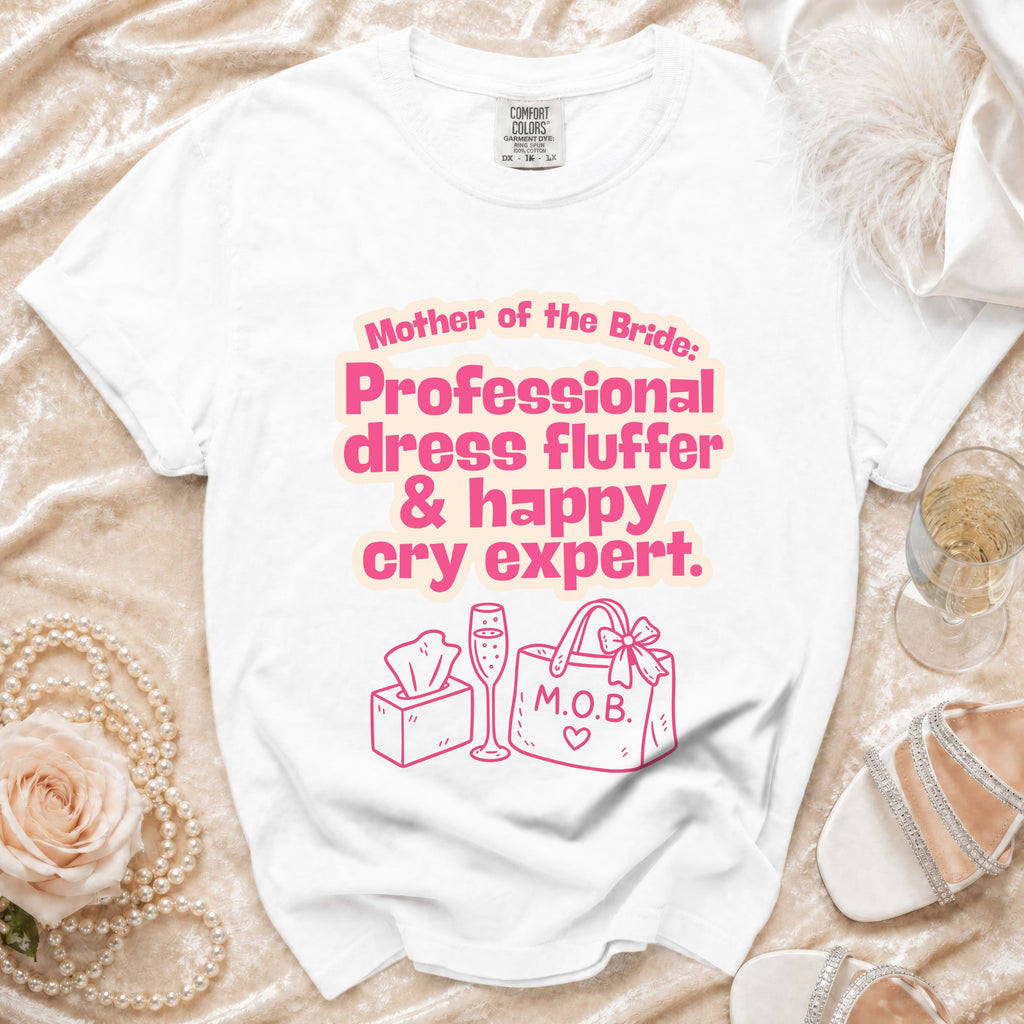 White t-shirt with "Mother of the Bride: Professional dress fluffer & happy cry expert." text and graphics.