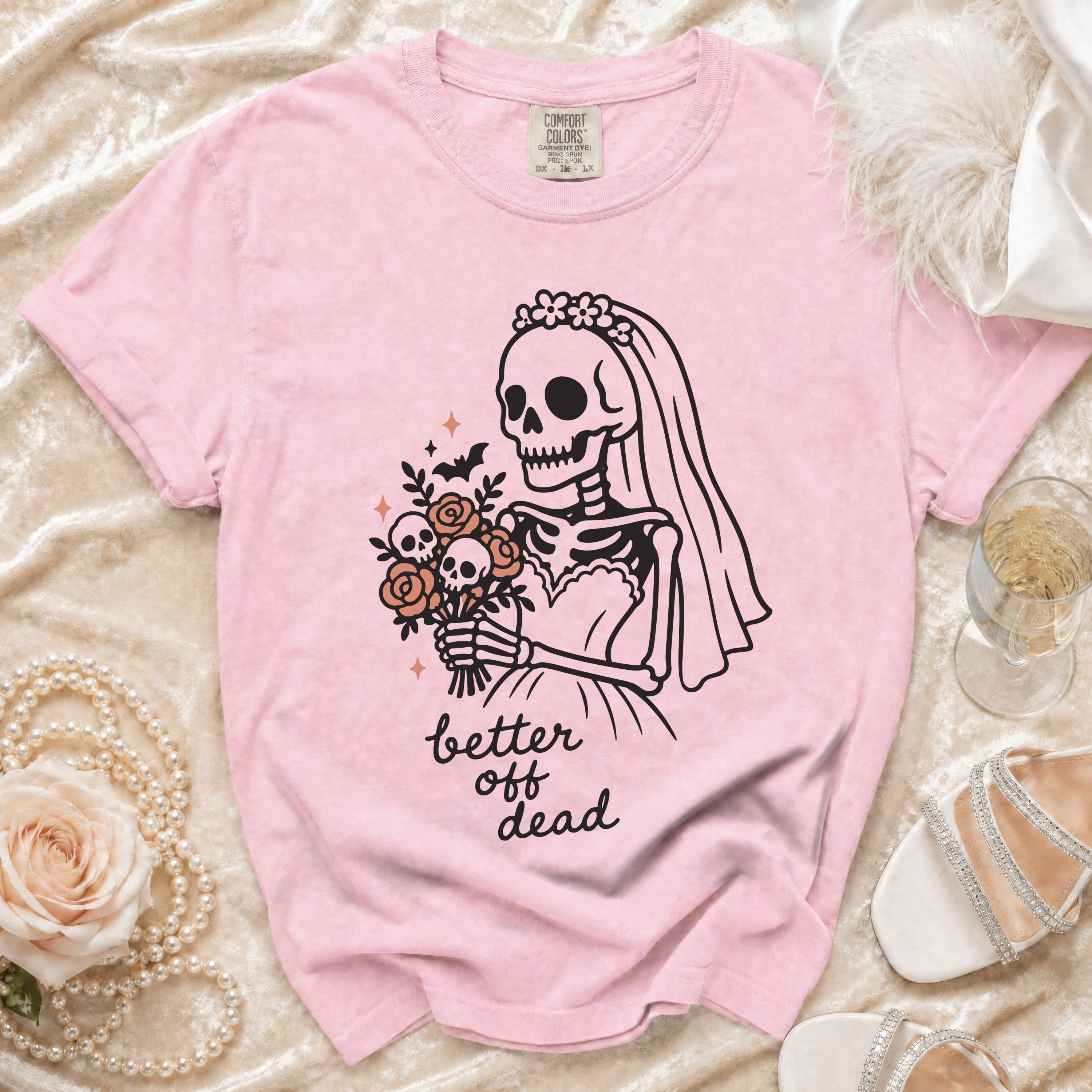 Pink t-shirt with skeleton bride graphic and text "better off dead".