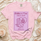 Pink t-shirt with "Reckless in Texas Olivia's Bach Austin, TX Summer 2026" graphic.