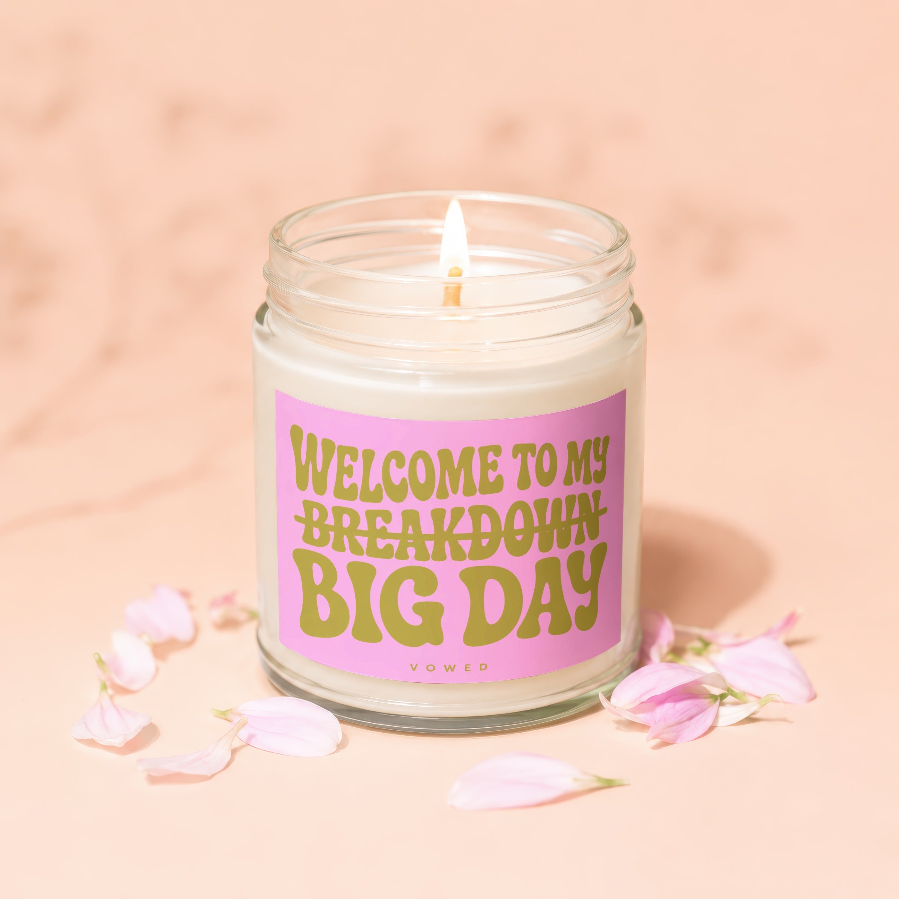 Candle with a pink label that reads "Welcome to My Breakdown Big Day"