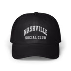 A black baseball cap featuring white embroidered text that reads NASHVILLE SOCIAL CLUB.