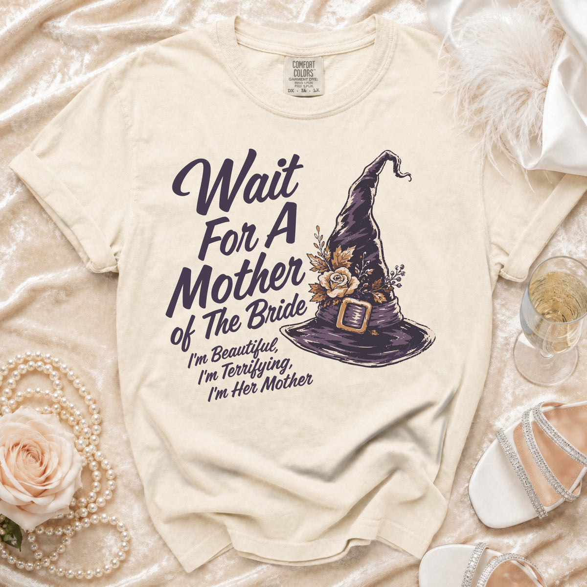 Cream t-shirt with "Wait For A Mother of The Bride" and witch hat graphic.