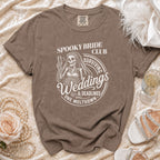 Brown t-shirt with "Spooky Bride Club Surviving Weddings & Deadlines One Meltdown" graphic.