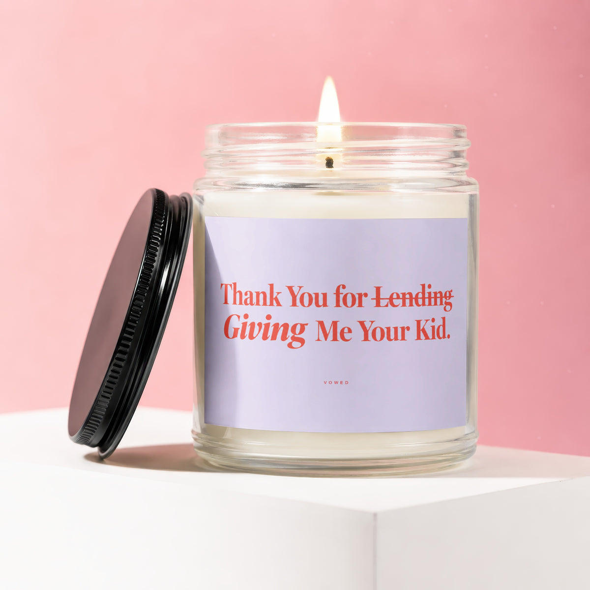 Scented candle with "Thank You for Lending Giving Me Your Kid" text.