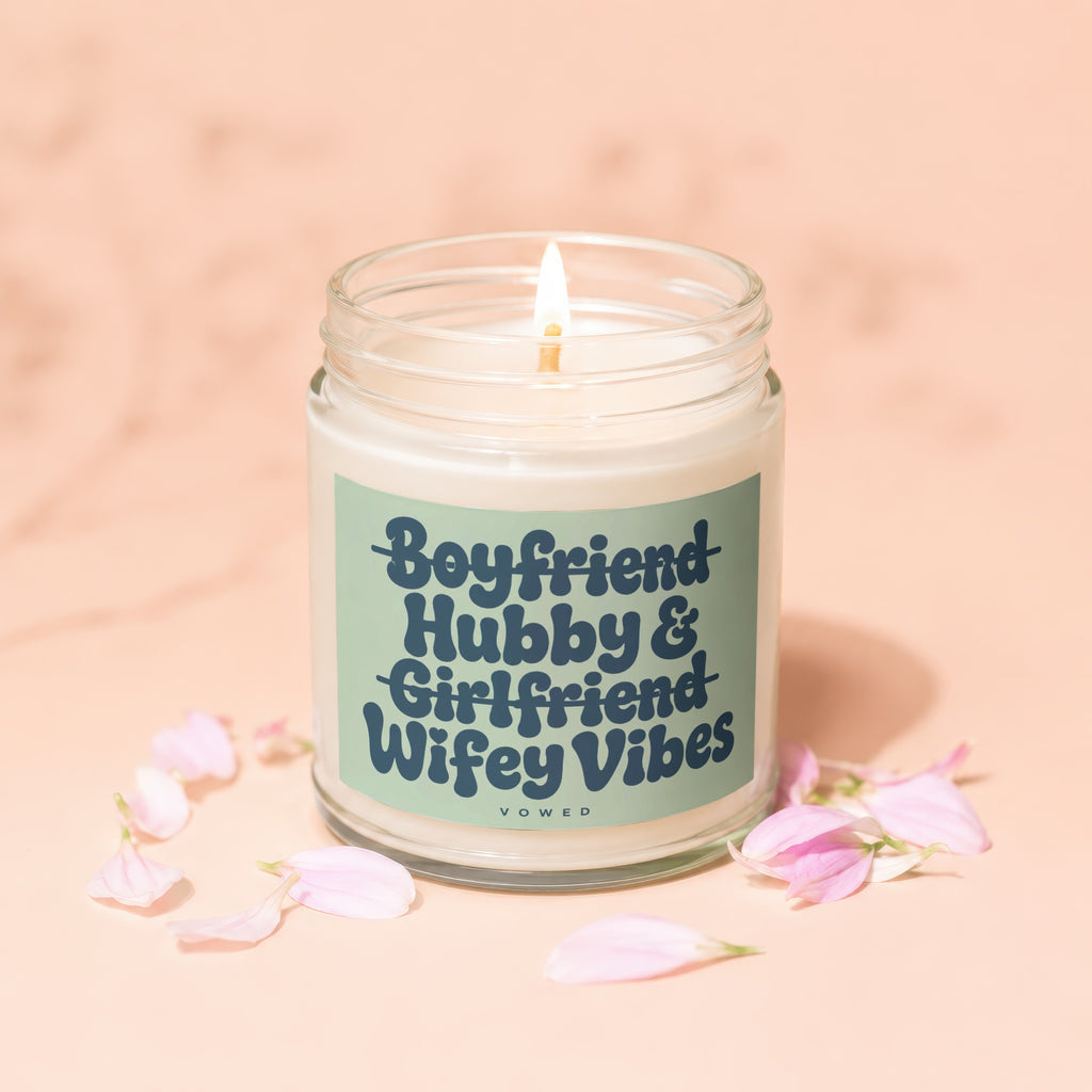 Candle with "Boyfriend Hubby & Girlfriend Wifey Vibes" text on a pale peach background.