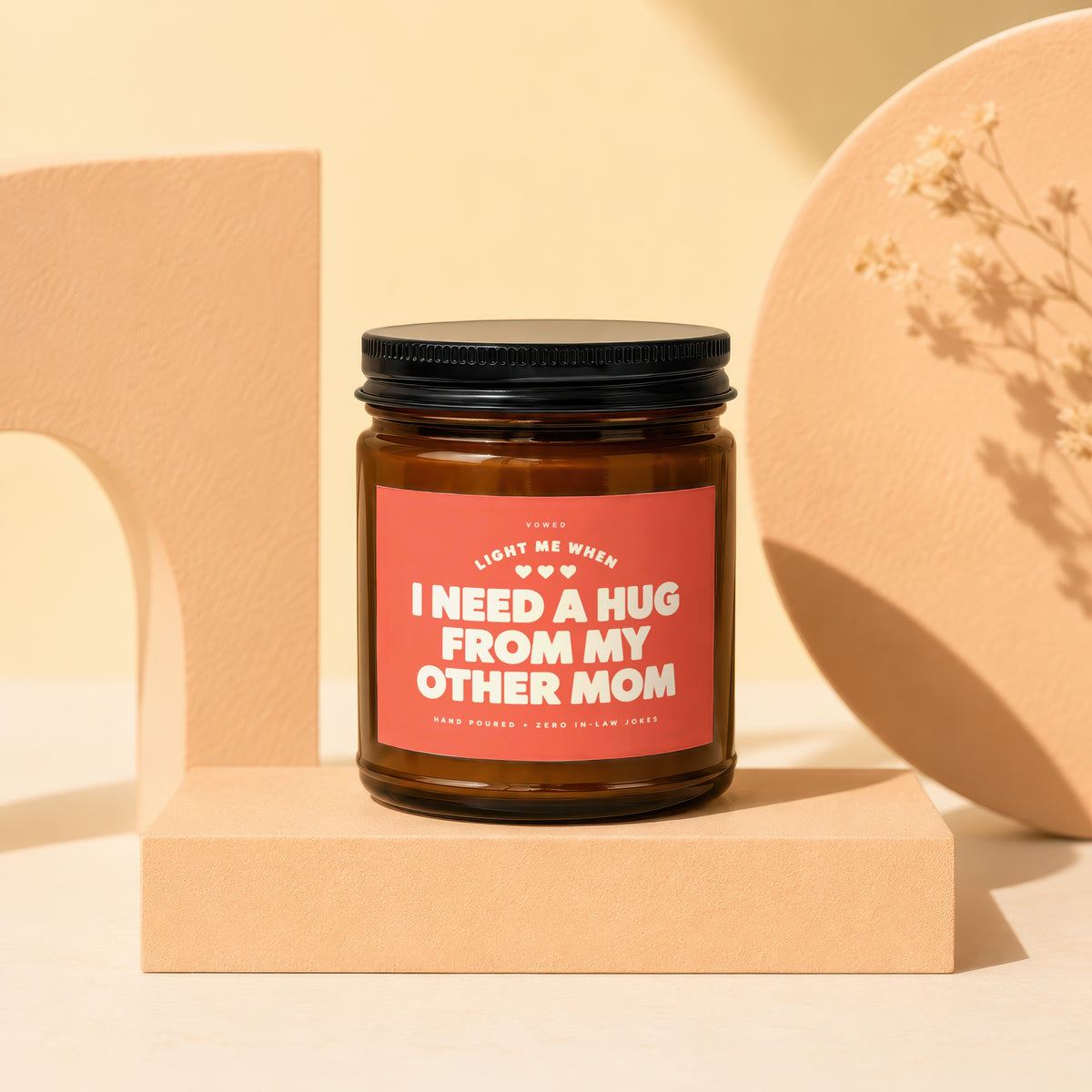 Amber jar candle with label: "LIGHT ME WHEN I NEED A HUG FROM MY OTHER MOM"