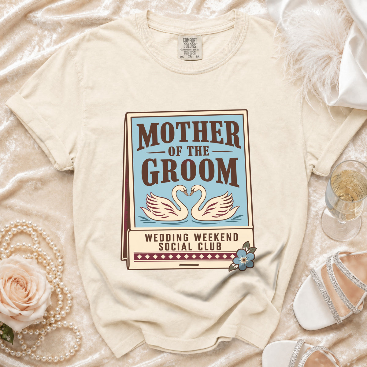 Cream t-shirt with "Mother of the Groom Wedding Weekend Social Club" graphic.