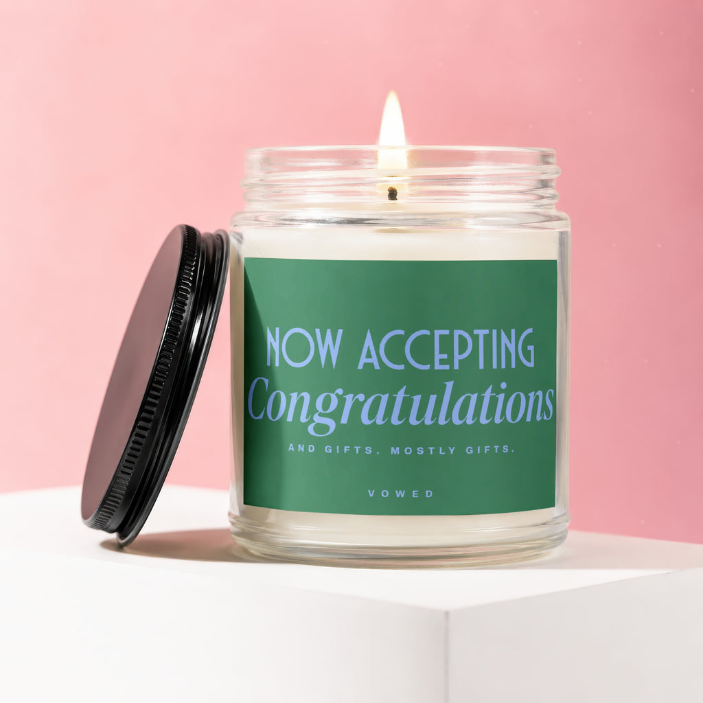 Candle with green label: "NOW ACCEPTING Congratulations AND GIFTS. MOSTLY GIFTS. VOWED"