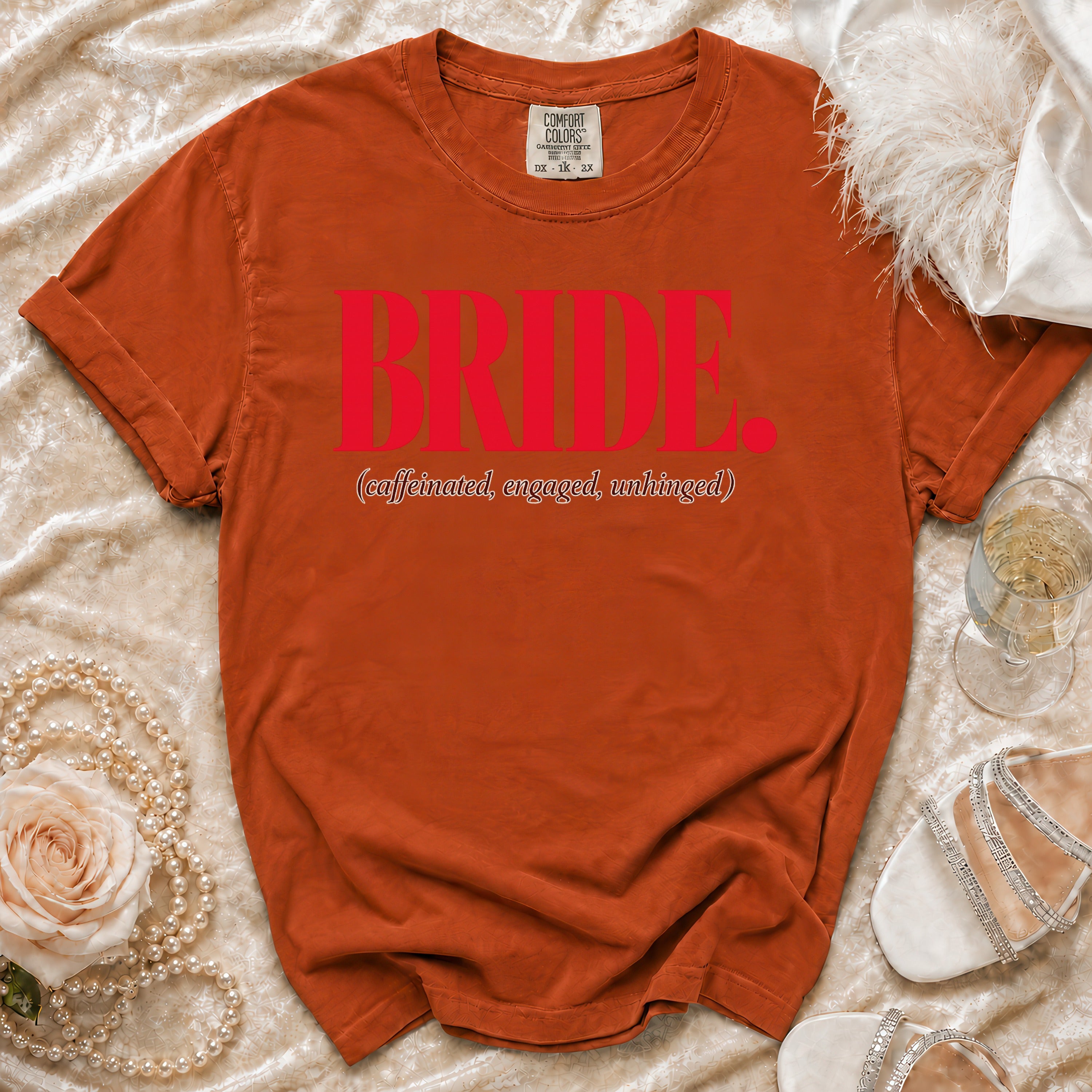 Orange t-shirt with "BRIDE. (caffeinated, engaged, unhinged)" in red text.