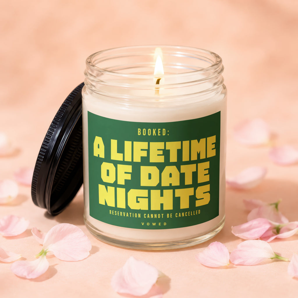 Scented candle with text: "BOOKED: A LIFETIME OF DATE NIGHTS, RESERVATION CANNOT BE CANCELLED"