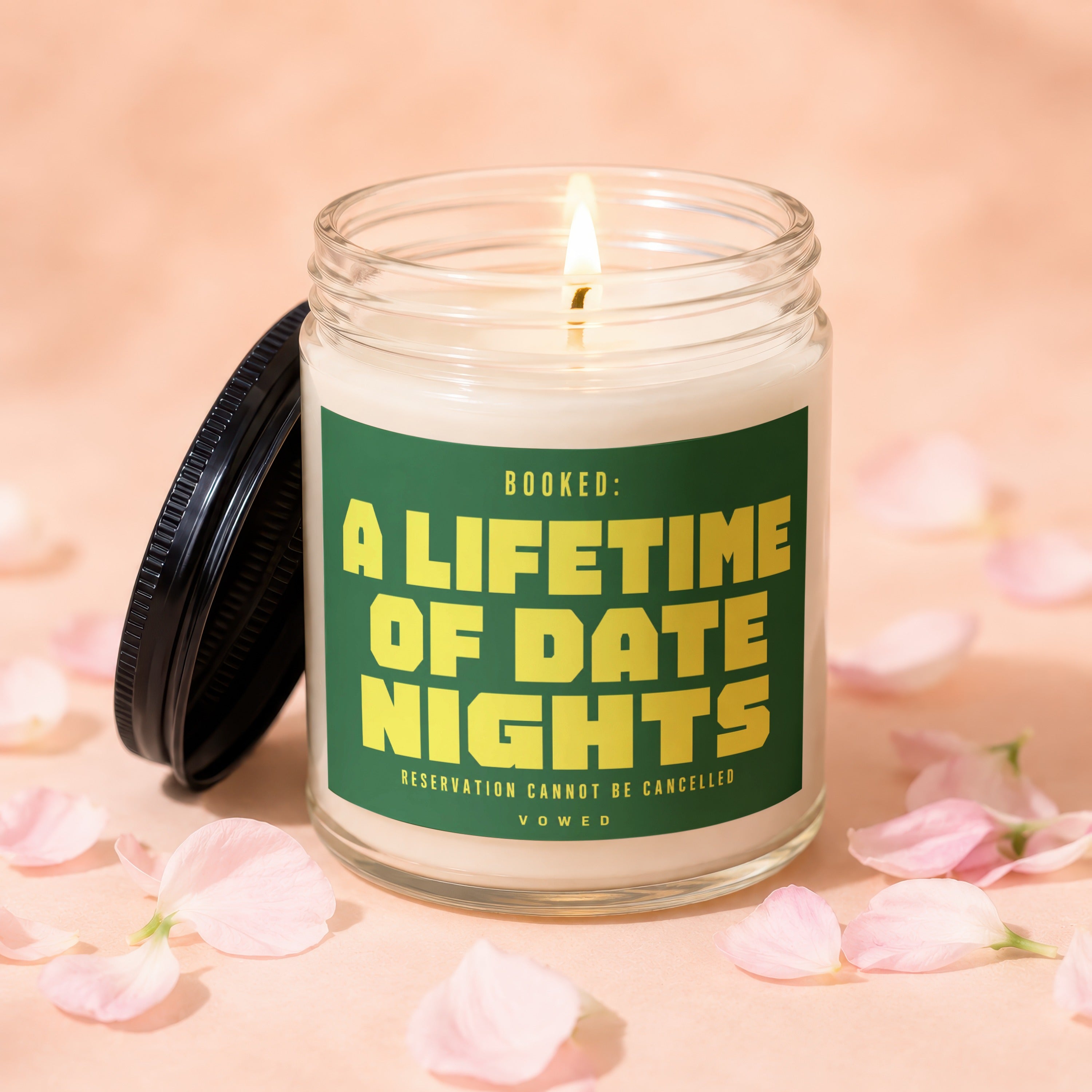 Scented candle with text: "BOOKED: A LIFETIME OF DATE NIGHTS, RESERVATION CANNOT BE CANCELLED"