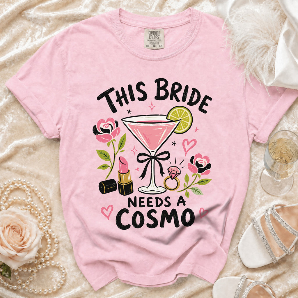 Pink t-shirt with "This Bride Needs a Cosmo" graphic and martini glass.