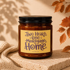 Amber candle with yellow label reading "Two Hearts, One Mortgage Home" VOWED.