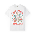 White t-shirt with "LAST SPLASH" flamingo graphic, drinks, and pool float.
