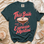 Dark teal t-shirt with "This Bride Needs an Espresso Martini" text and cocktail graphic.