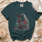 Teal t-shirt with "This Bride Bites" text and gothic bride-themed graphic.