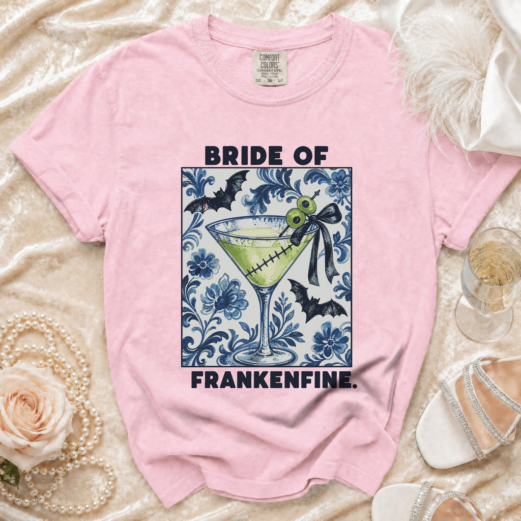 Pink t-shirt with "Bride of Frankenfine" text and a Halloween cocktail graphic.
