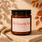 Brown glass candle labeled "My Favorite Yes" with scent notes.