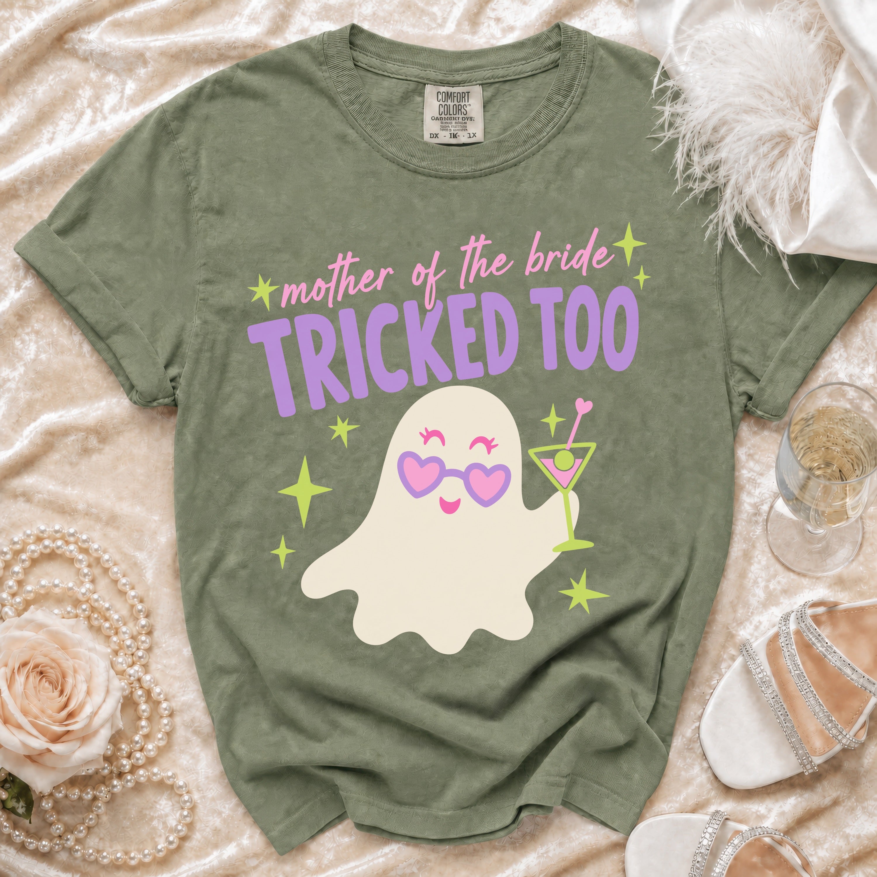 Olive green t-shirt with "mother of the bride TRICKED TOO" text and a ghost graphic.