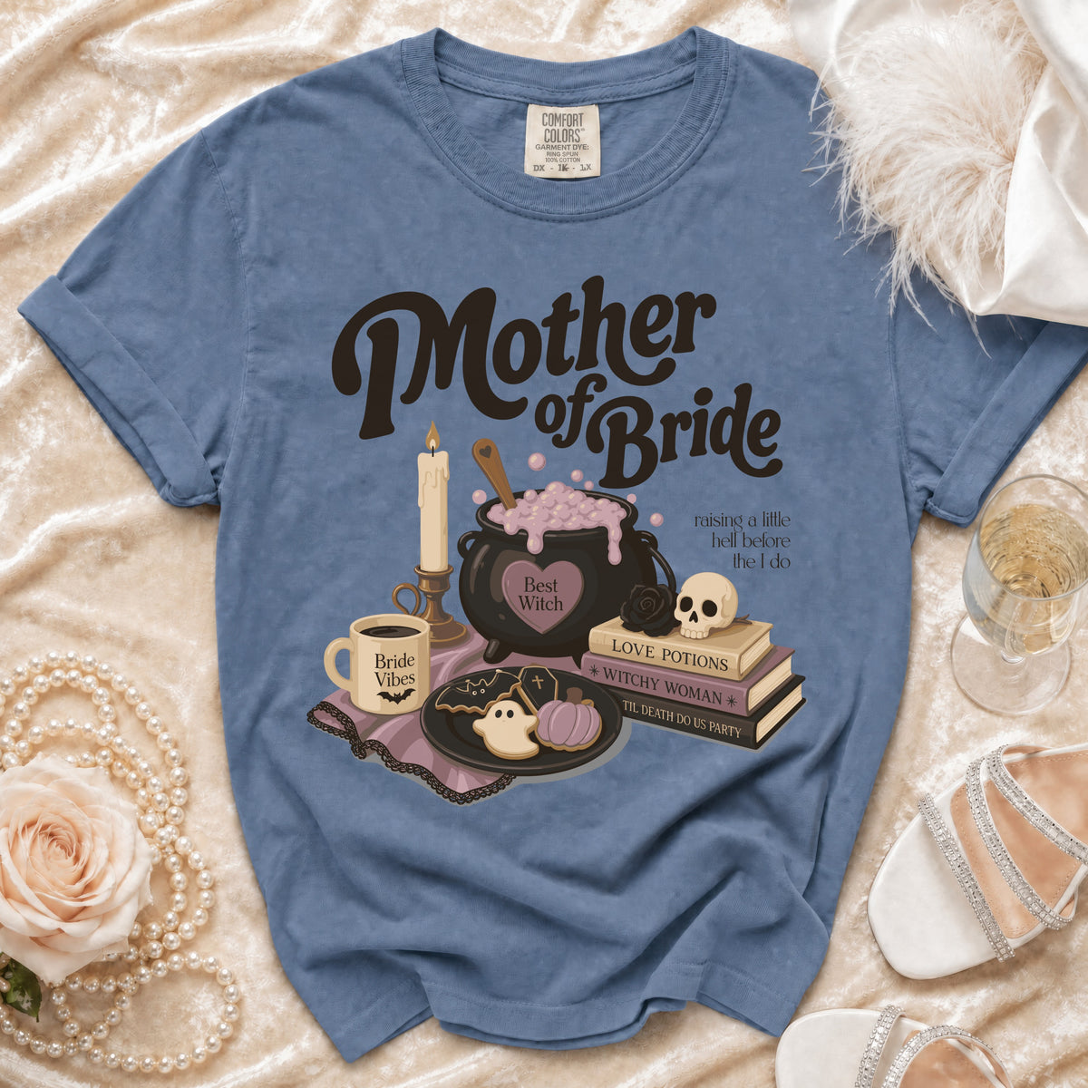 Blue t-shirt with "Mother of Bride" and witchy graphics, "Bride Vibes" mug.