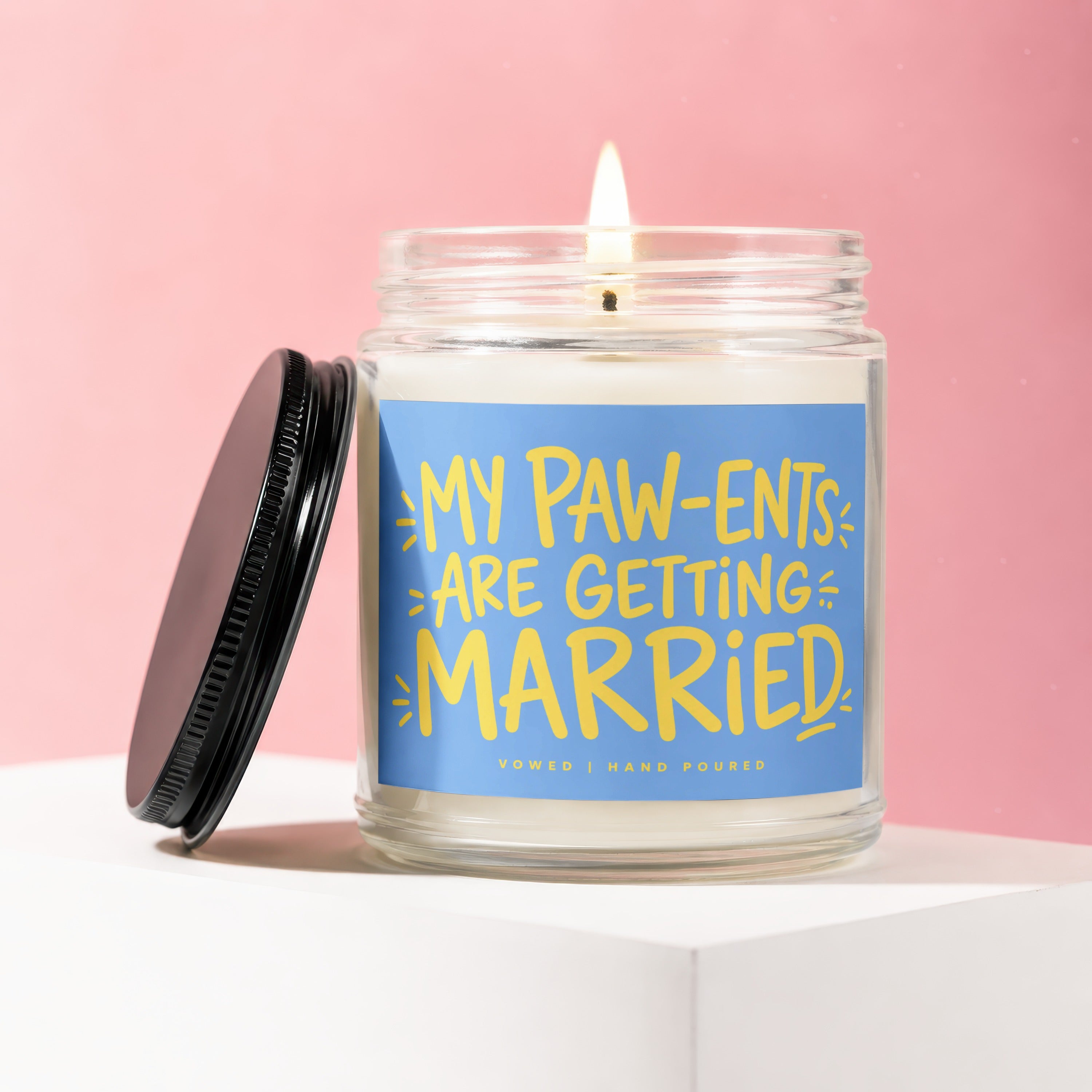Candle with "My Paw-ents Are Getting Married" text on blue label.