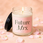 Lit candle in glass jar with "Future Mrs." and "VOWED" on label.