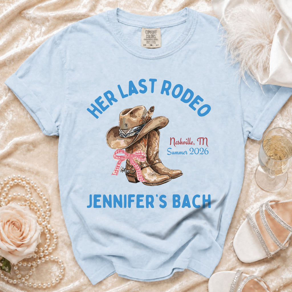 Light blue t-shirt with "Her Last Rodeo" and "Jennifer's Bach" text and cowboy boot graphic.