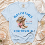 Light blue t-shirt with "Her Last Rodeo" and "Jennifer's Bach" text and cowboy boot graphic.